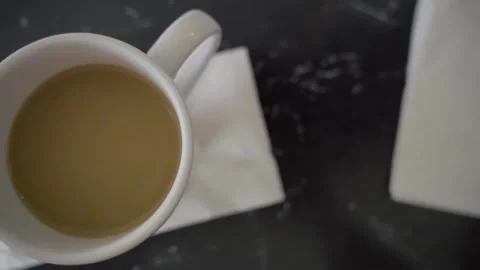 Cup of coffee diner overhead close up slow motion pan left Cherry NJ 4k Stock Footage 274844360