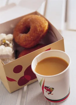 Cup of coffee with donut Stock Photos
