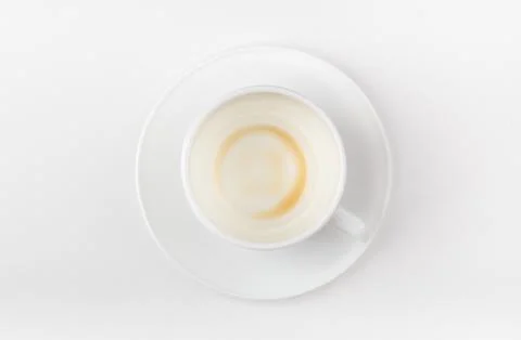 A cup of coffee drunk on a white background. Top view. Stock Photos