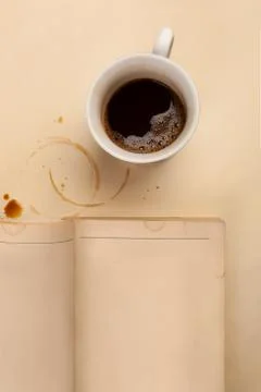 Cup of coffee with empty notebook. Stock Photos