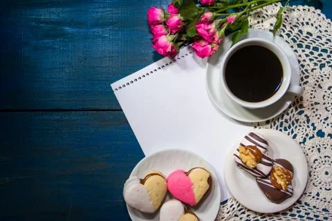 Cup of coffee with flowers and note with place for text Stock Photos
