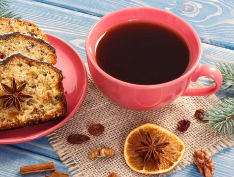 Cup of coffee, fresh baked fruitcake for Christmas and spruce branches Stock Photos