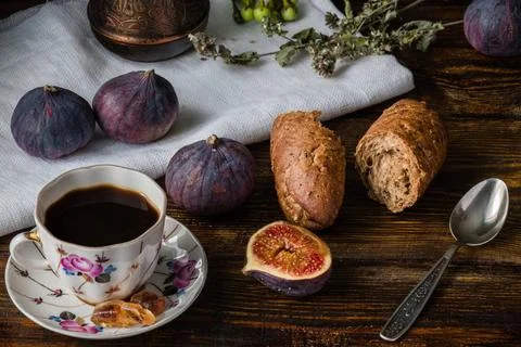 Cup of coffee with fresh bread and some figs Cup of coffee with fresh brea... Stock Photos