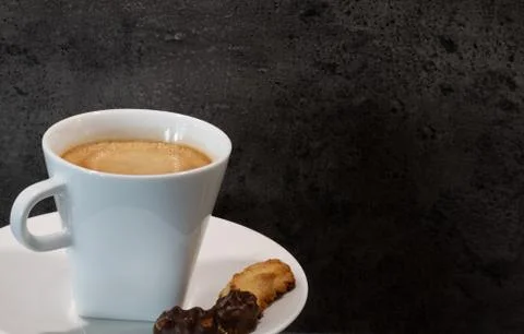 Cup of coffee in front of a grey background Stock Photos