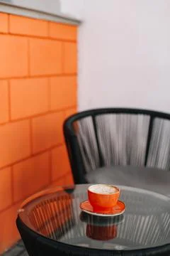 A cup of coffee on glass table in the morning Stock Photos