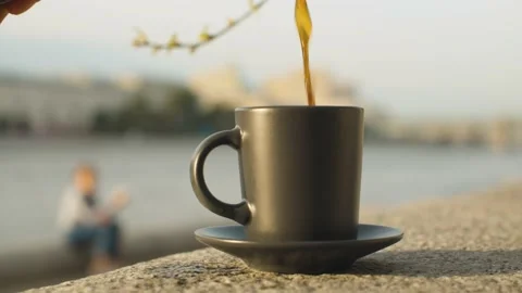 Cup of coffee on a granite parapet Vidéo 140426322
