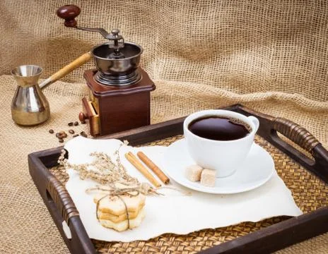 Cup of coffee with grinder Stock Photos