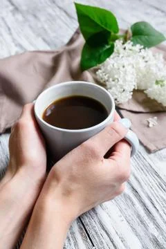Cup of coffee in hands Stock Photos