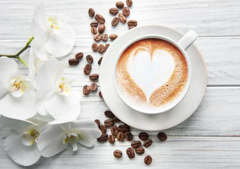 A cup of coffee with heart pattern Stock Photos