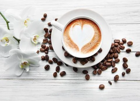 A cup of coffee with heart pattern Stock Photos