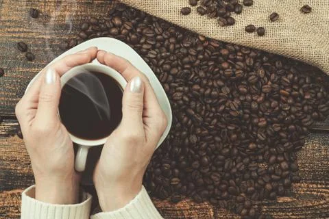 Cup of coffee in her hands Stock-Fotos