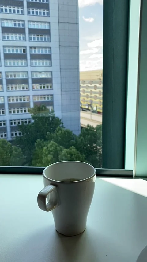 A cup of coffee on a high floor of a building in Bremen, Germany. Video stock 342002092