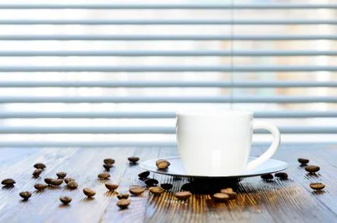 Cup of coffee on the kitchen table Stock Photos