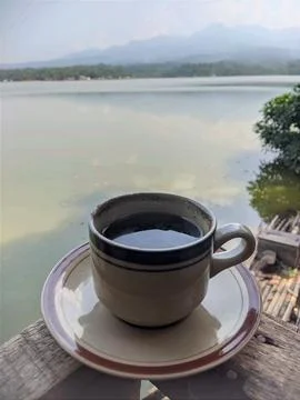 A cup of coffee in the lake Stock Photos