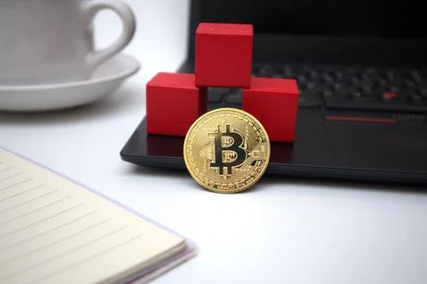 Cup of coffee, laptop, notebook, bitcoin and 3 red blocks Stock Photos