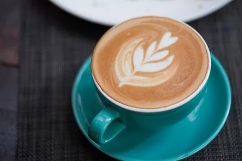 A cup of Coffee Latte on the table Stock Photos