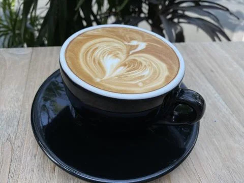 A cup of coffee latte on the table Stock Photos