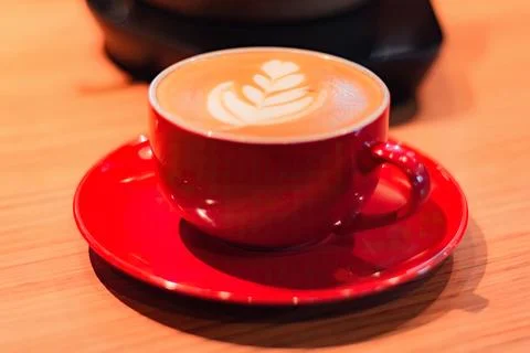 Cup of coffee latte on table with selective focus Stock Photos