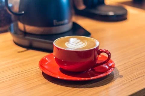 Cup of coffee latte on table with selective focus Stock Photos