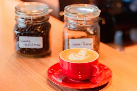 Cup of coffee latte on table with selective focus Stock Photos