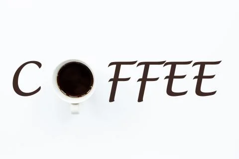 Cup of coffee lying on white background. Flat lay style. Coffee concept. Usef Stock-Fotos