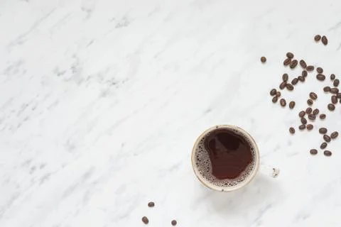 Cup of coffee on a marble surface with copy-space Stock Photos