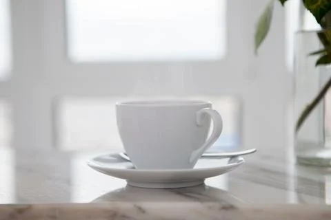 Cup of coffee on marble table Stock Photos