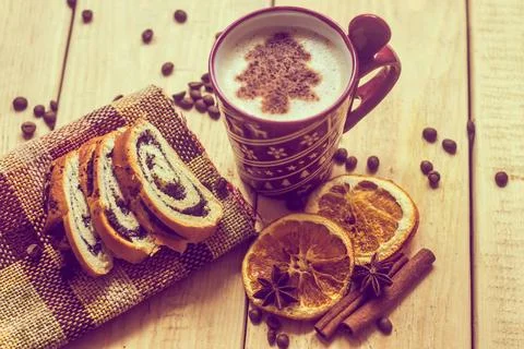 Cup of coffee with a new year pattern. Christmas tree made of cinnamon in ... Stock Photos