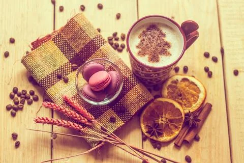 Cup of coffee with a new year pattern. Christmas tree made of cinnamon in ... Stock Photos