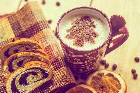 Cup of coffee with a new year pattern. Christmas tree made of cinnamon in ... Stock Photos