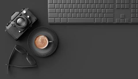 Cup of coffee next to the camera, keyboard and glasses on a black background Illustrazione stock