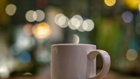 Cup of coffee at night time Stock Photos