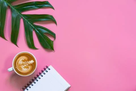 A cup of coffee with note and copy space on pink background. Food and drink c Stock Photos