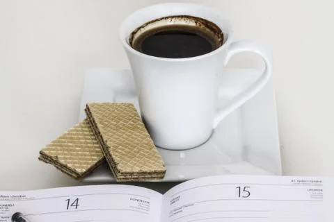 Cup of coffee with notebook Stock Photos