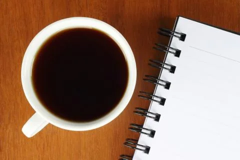 Cup of coffee with notepad Stock Photos
