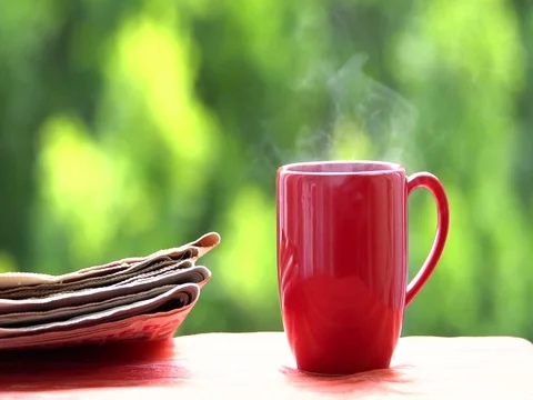 Cup of coffee or tea hot drink on window sill and reading books Vidéo 76093682