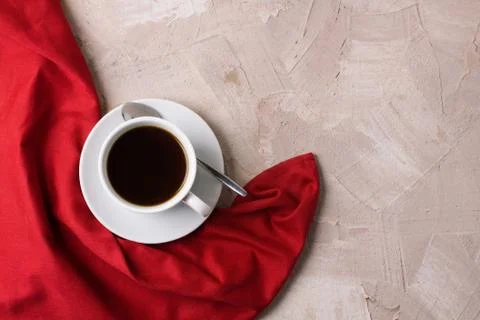 Cup of coffee or tea red napkin concrete background Stock Photos