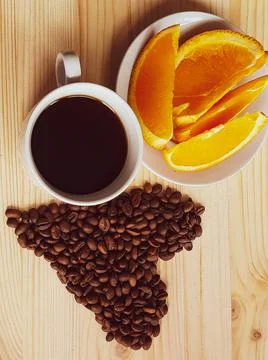 A cup of coffee with an orange Foto stock