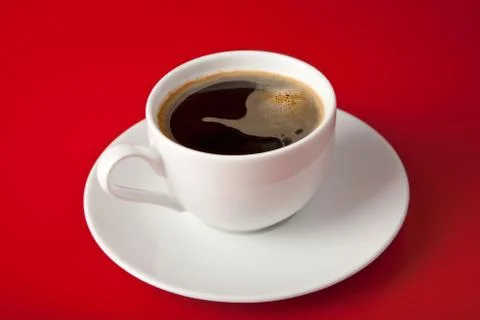 Cup of coffee over red background Stock Photos