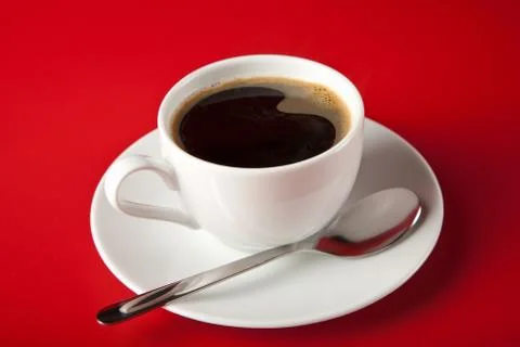 Cup of coffee over red background Stock Photos