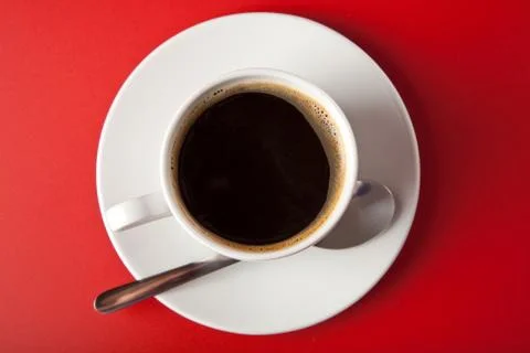 Cup of coffee over red background Stock Photos