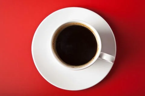 Cup of coffee over red background Stock Photos