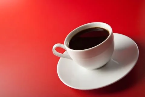 Cup of coffee over red background Stock Photos