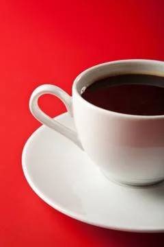Cup of coffee over red background Stock Photos
