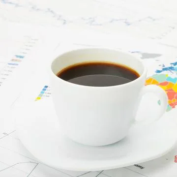  Cup of coffee over world map and financial documents Cup of coffee over w... 스톡 사진