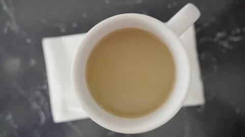 Cup of Coffee overhead slow motion pan right Cherry Hill NJ 4k Stock Footage 274844362