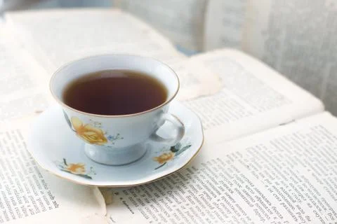 Cup of coffee on paper sheets background Stock Photos