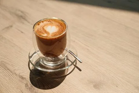 A cup of coffee with a pattern of heart. beautiful serving of hot drinks. 스톡 사진