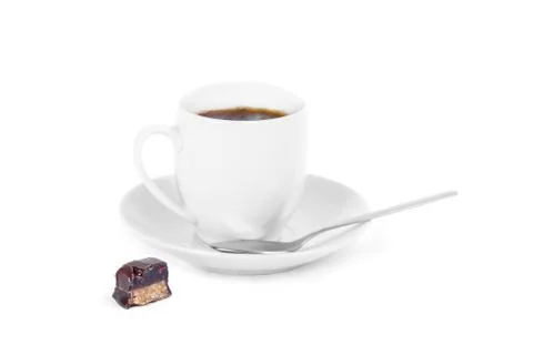 Cup of coffee with a piece of candy Stock Photos
