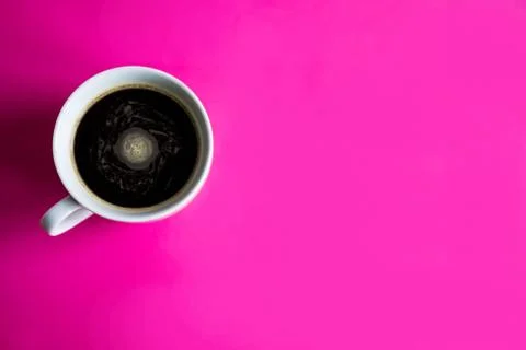 Cup with coffee on a pink background. Concept with coffee. Background with co Stock Photos